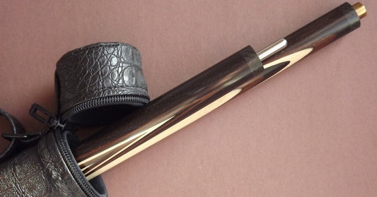A close-up look at the top of a pool cue case. The case is currently open and both halves of the cue are sticking out.
